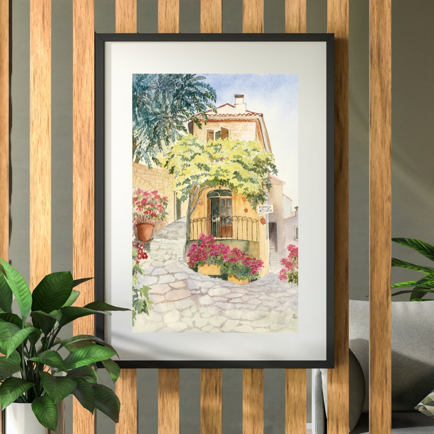 Framed and mounted print of Provence Pottery hanging on a slatted wooden room divider